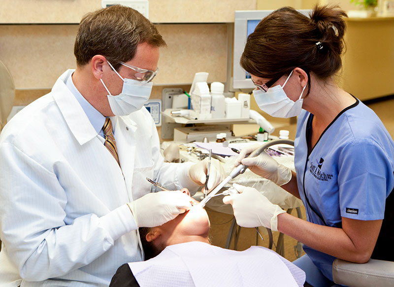 Photo of Dr. Welch and assistant doing a root canal