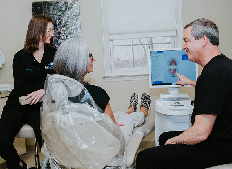 Photo of dental patient learning about root canal treatment