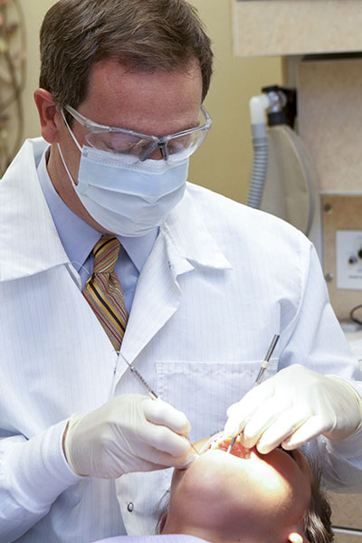 Photo of Dr. Welch giving oral cancer screening review